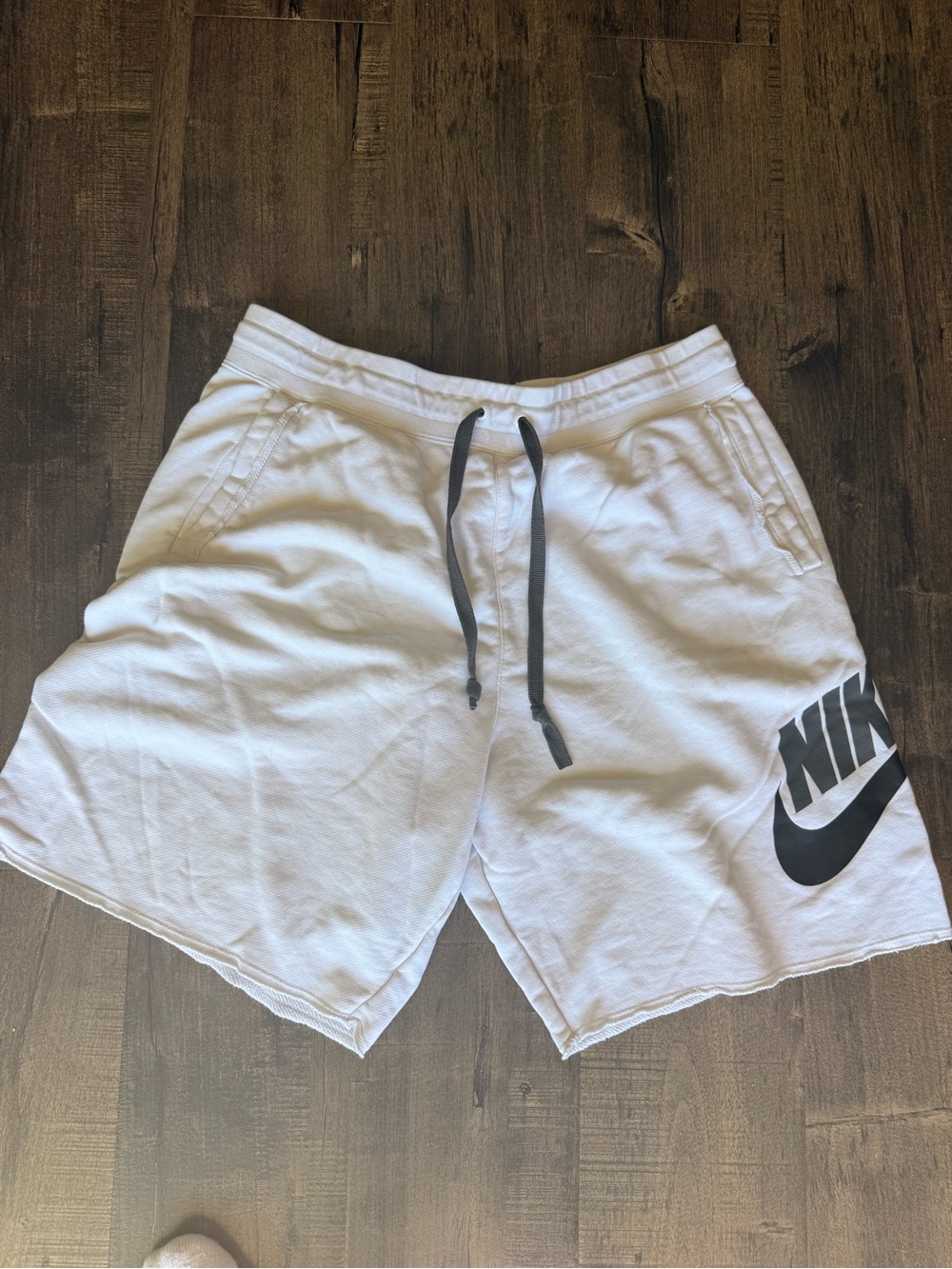 Nike Men's White Athletic Shorts with Black Logo
